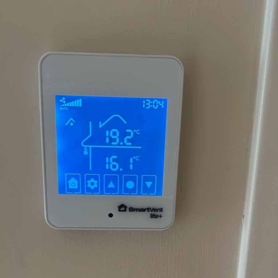 SmartVent Lite+ wall controller showing temperature